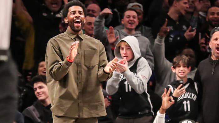 Brooklyn Nets guard Kyrie Irving (11) celebrates after the Nets take the lead against the New York Knicks in the fourth quarter.